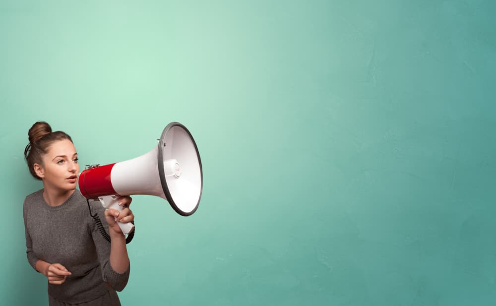 A woman holding a megaphone
