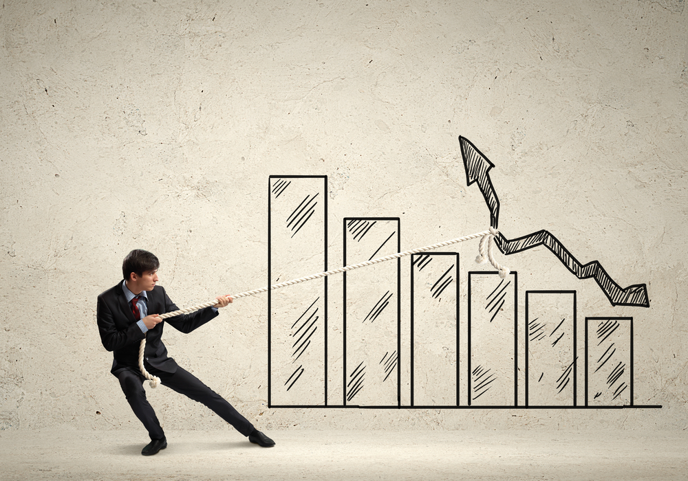 A man pulling on a rope, that's attached to a line drawn on a graph