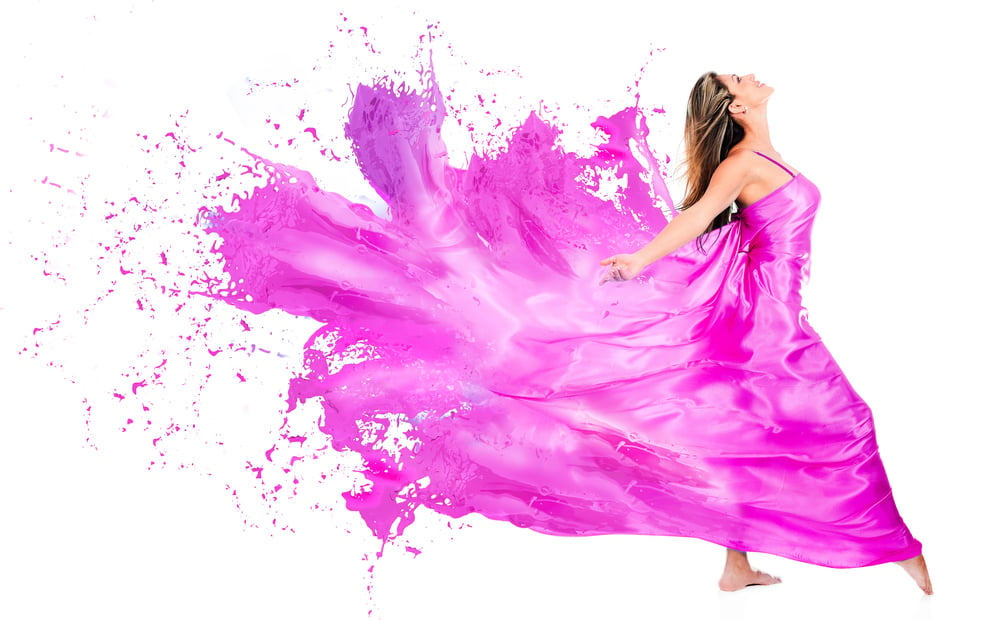 Happy woman in pink paint dress - isolated over white background