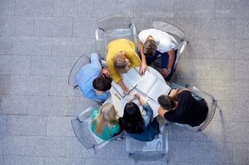 Birdseye photo of a group of people sitting at a table